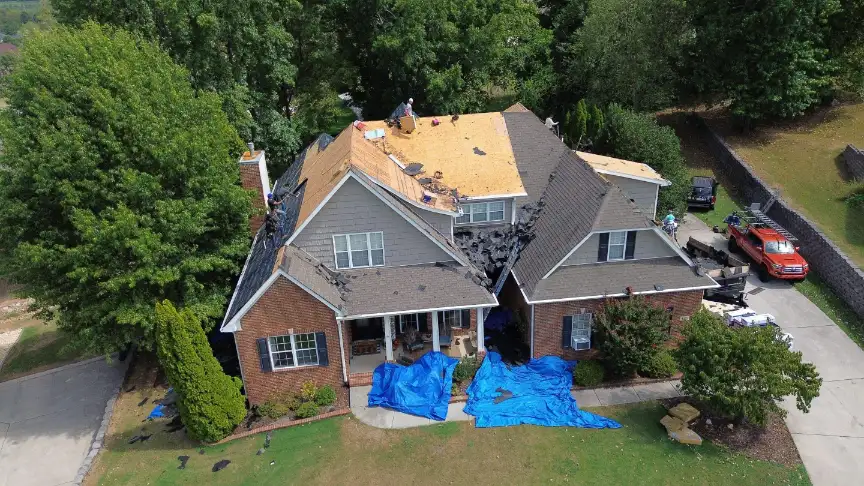 Hazel Green roofers performing a partial tear-off and repair on a local home