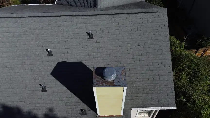 Gray shingled roof with a large chimney replaced in Hazel Green