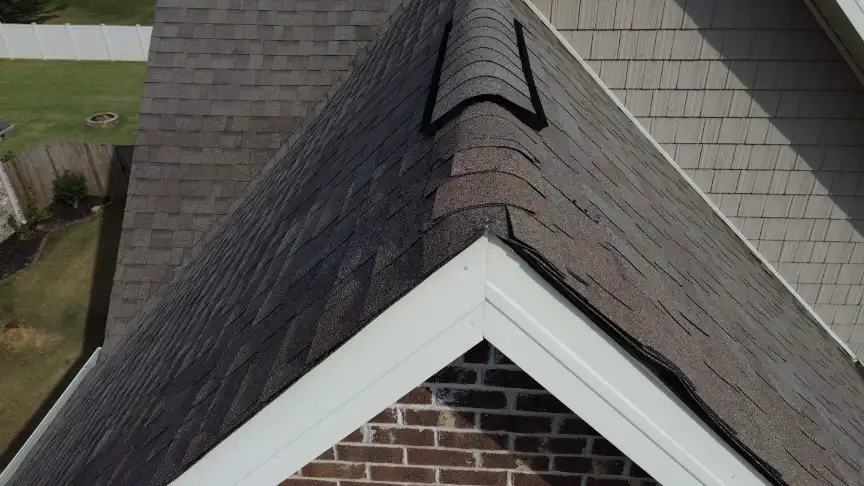 Dark gray shingle roof with intersecting slopes in Decatur Alabama