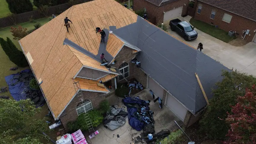 Plywood decking and tarp installation during a Hazel Green roof repair