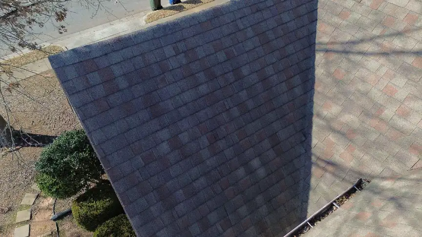 Freshly installed gray roof and gutters in a Hazel Green neighborhood