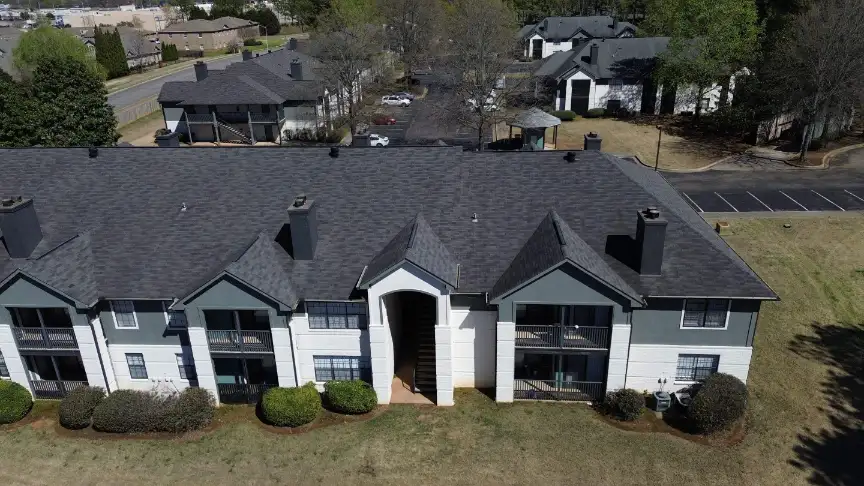 Commercial roofing contractors in Huntsville installing a durable system for a large apartment complex.