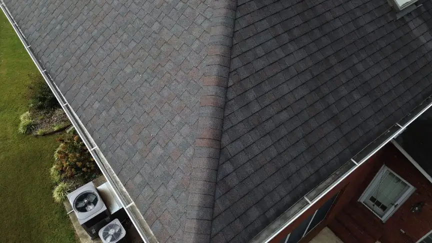 Clean gray shingles and white gutters completed by a Hazel Green roofing company