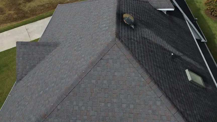 Finished dark shingle roof with skylight in Hazel Green AL