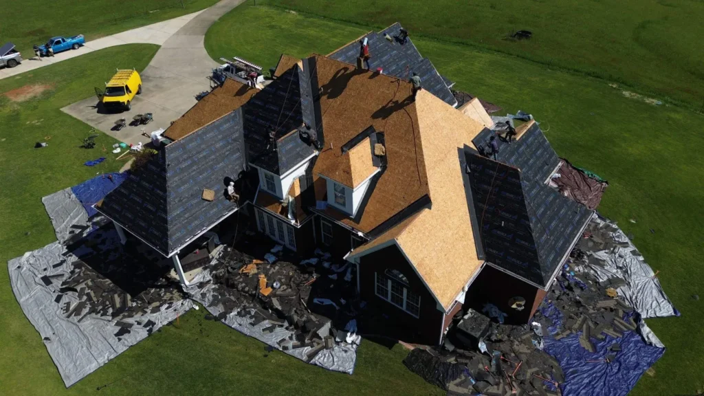 Roof replacement in progress on a North Alabama home while the homeowner considers project payment options