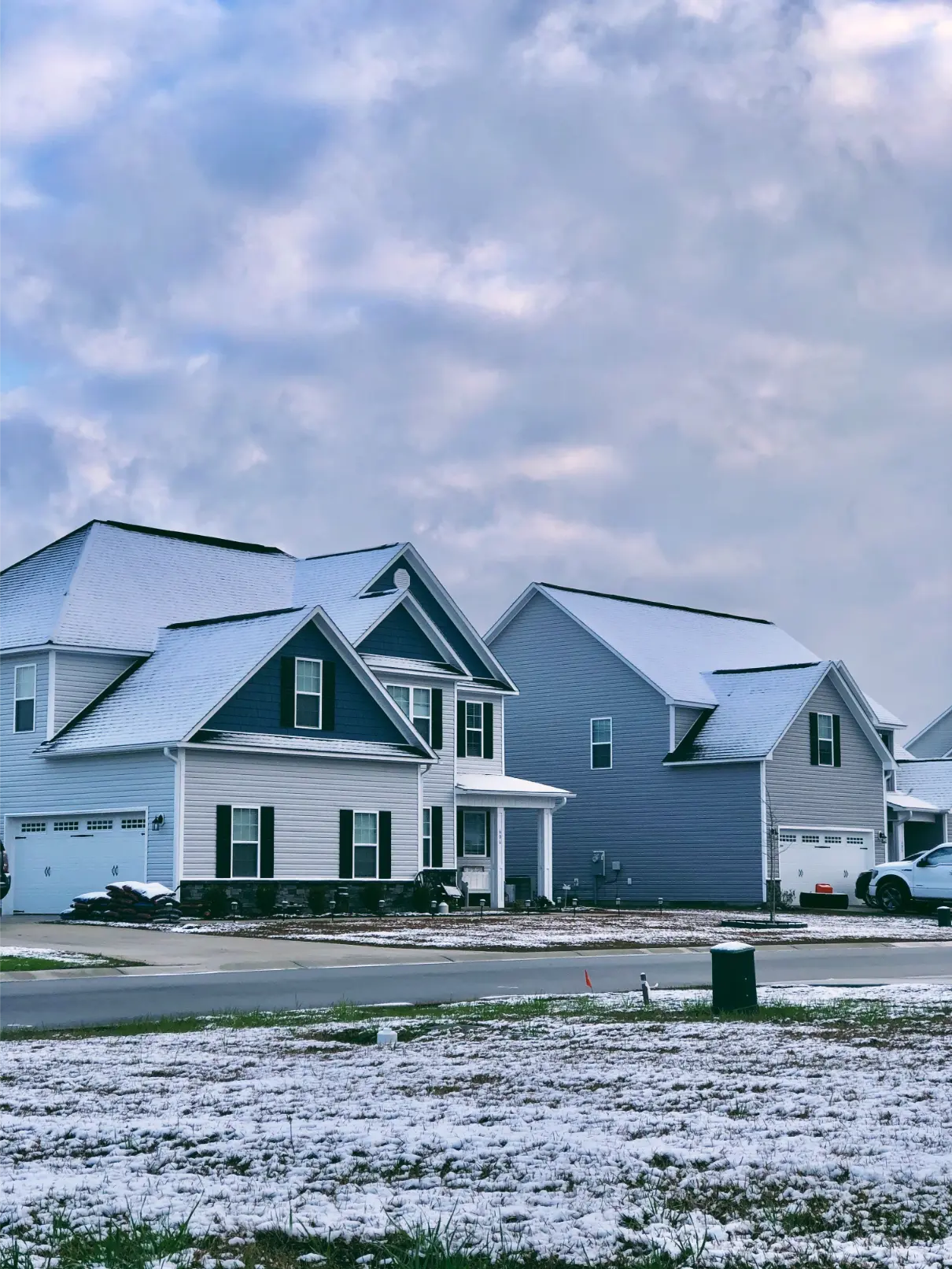 Roofing contractor installing a new roof during winter in Huntsville Alabama.